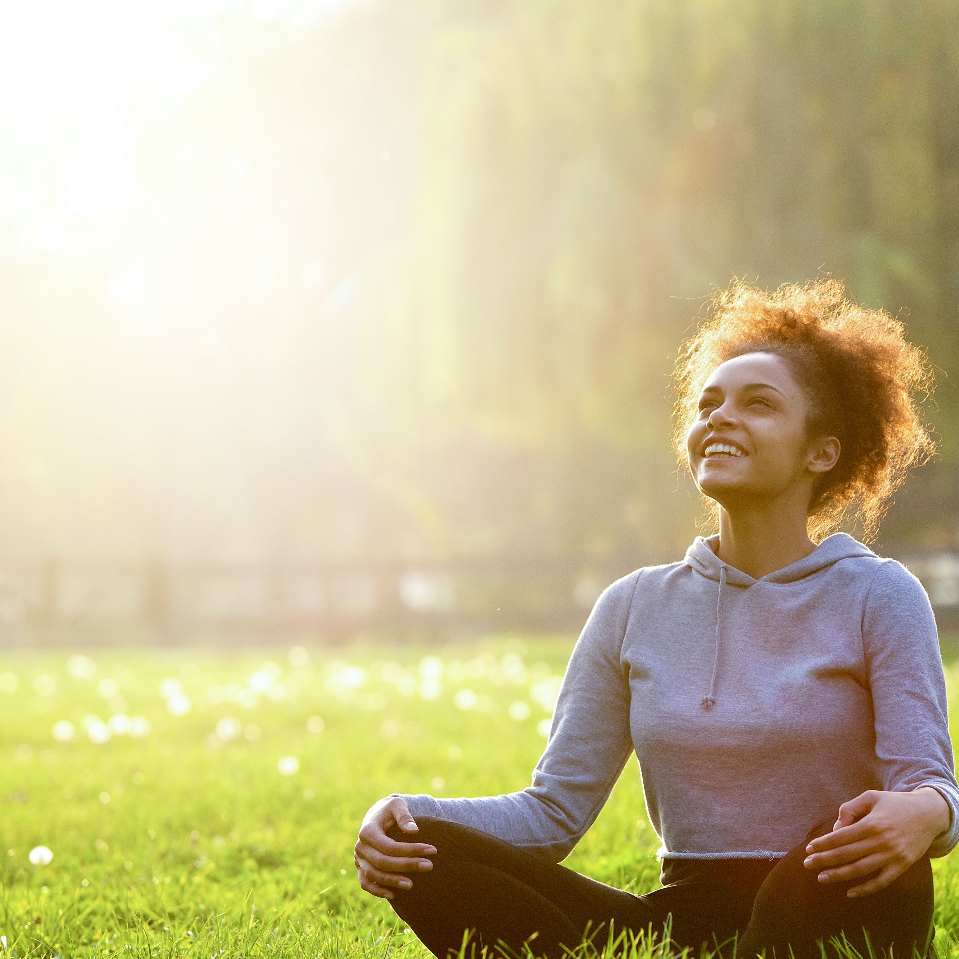 Woman meditating outdoors